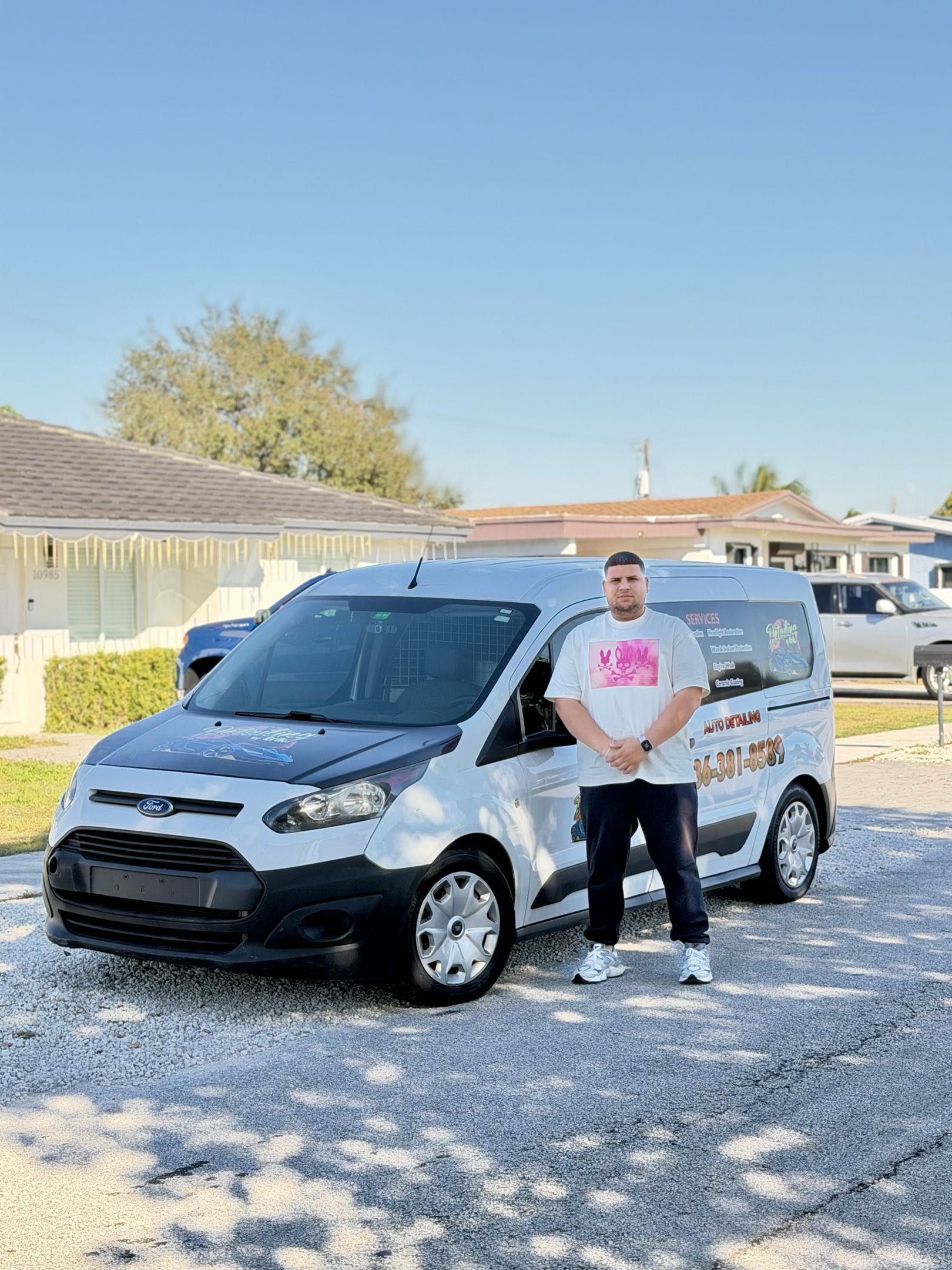 Erik standing with his detailing setup